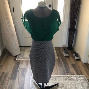 Never worn one piece dress. Light weight top with fitted skirt